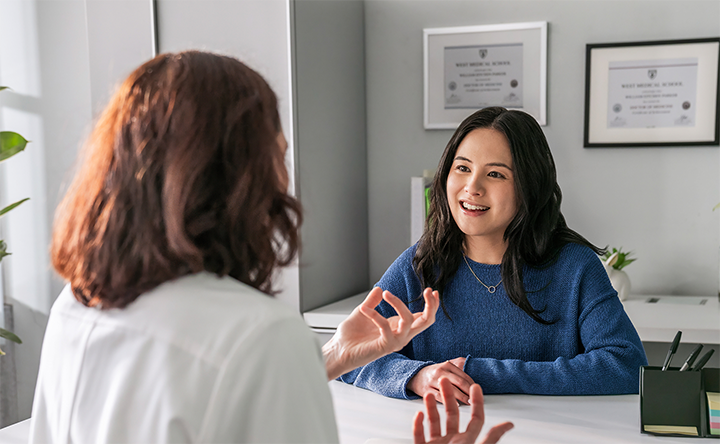 A doctor speaking with her patient