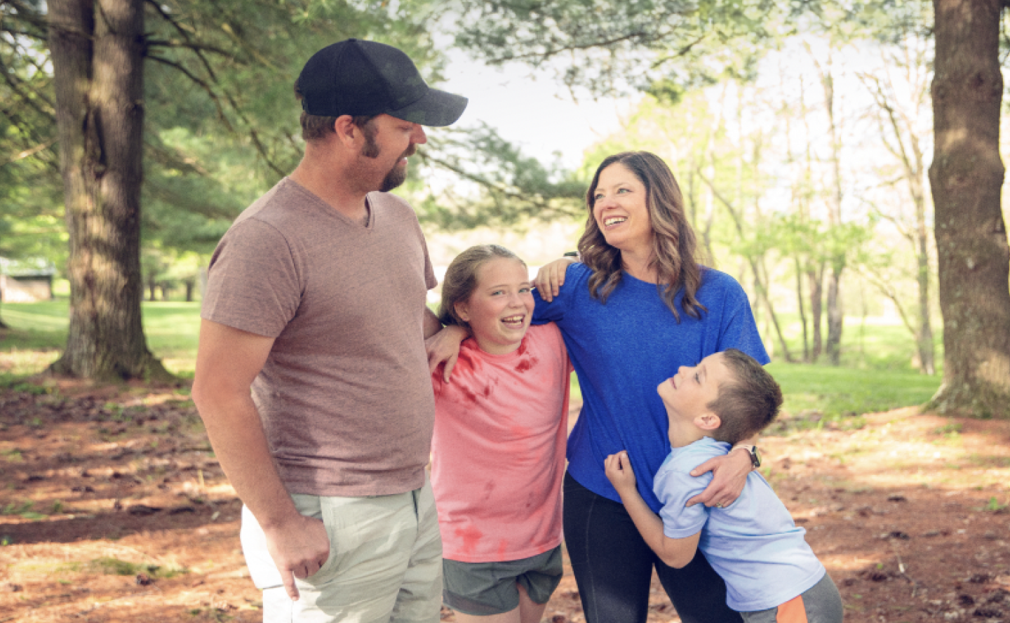 Katie, a TZIELD® (teplizumab-mzwv) patient, with her family and dog outdoors